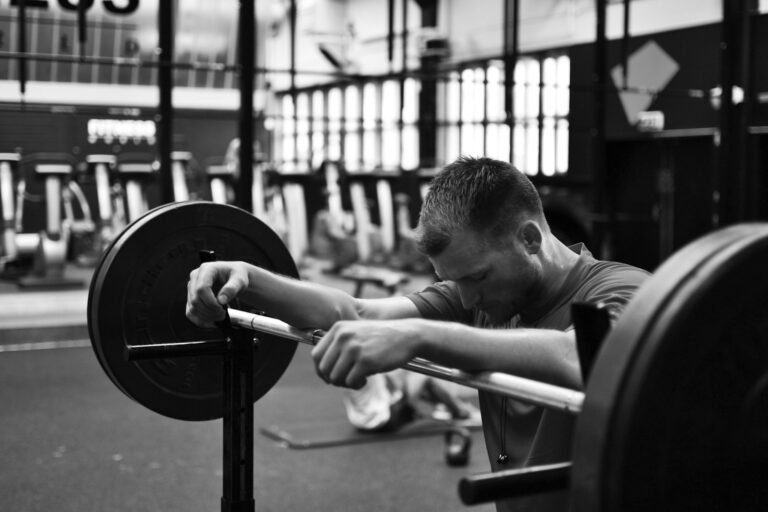 Athlete performing kettlebell deadlift posterior chain workout