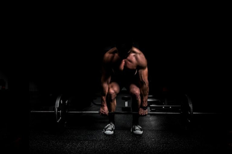 Athlete performing barbell row as t-bar row alternative at gym